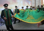 عکس/ اهتزاز پرچم امام رضا(ع) در کمیته ملی المپیک